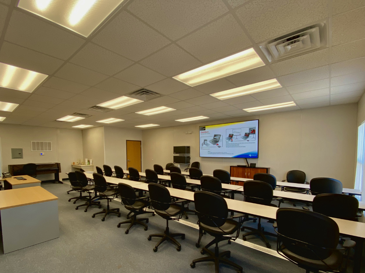 A large room with many chairs and tables