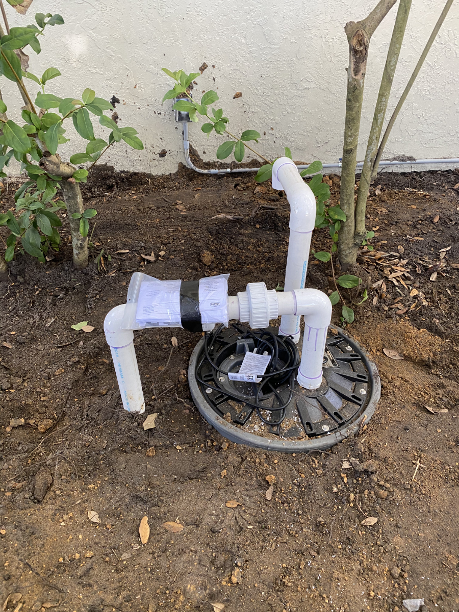 A pipe sitting on top of the ground.