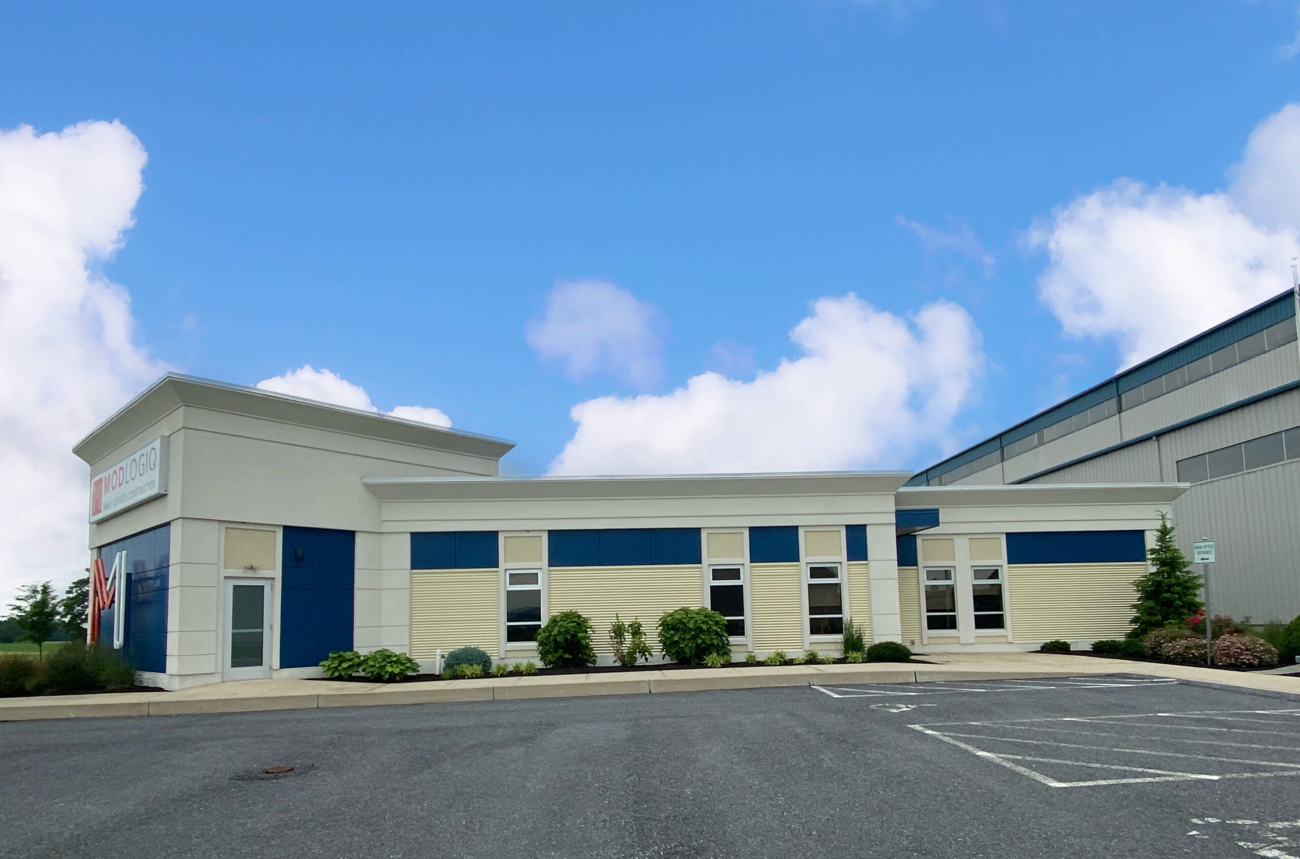 A large building with many windows and doors.