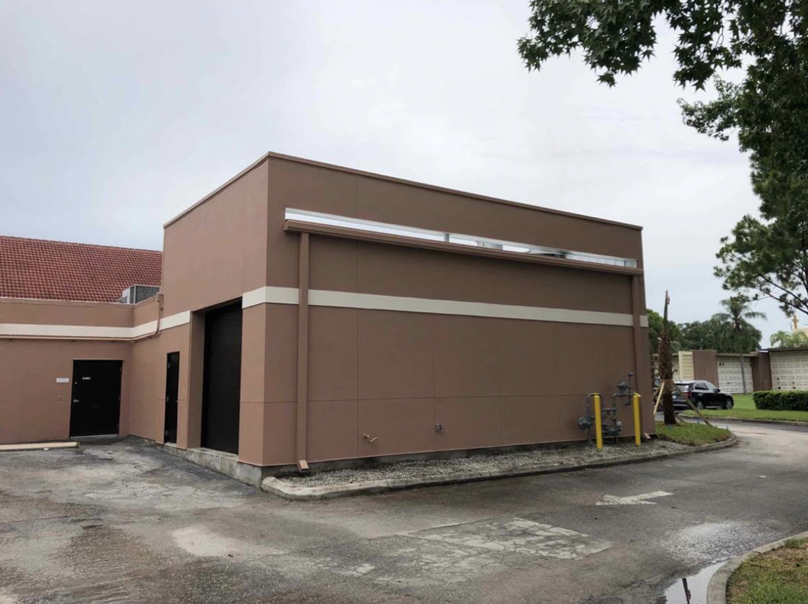 A building that is brown and has some windows.